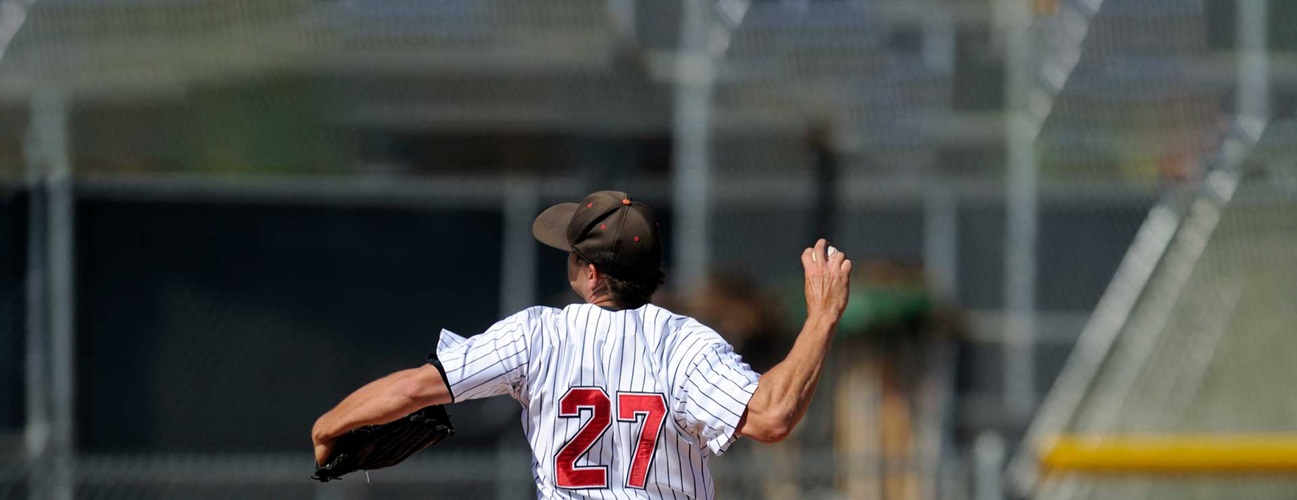 Baseball player pitching at mound