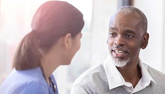 Patient asking his nurse questions.