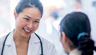 A doctor speaks to a patient.