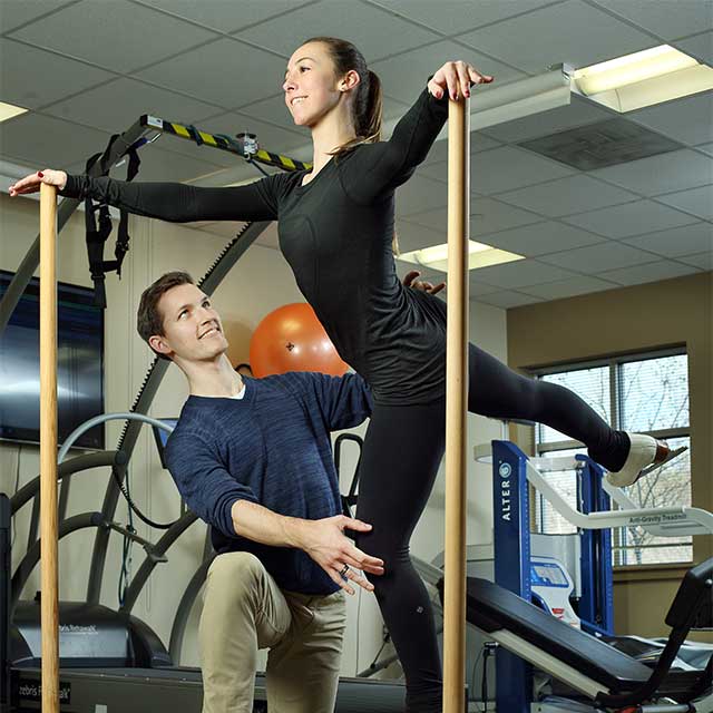 Kimmie Meissner working with a physical therapist 