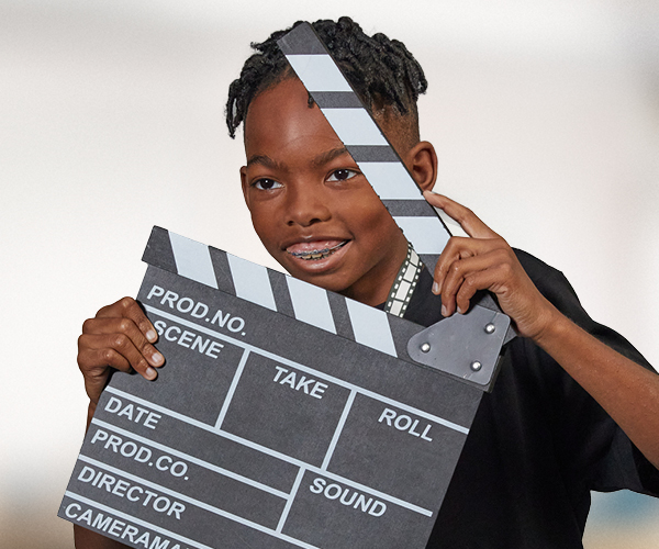 Marcus with a directors clapperboard