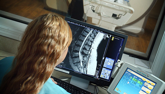 woman looking at mri screen