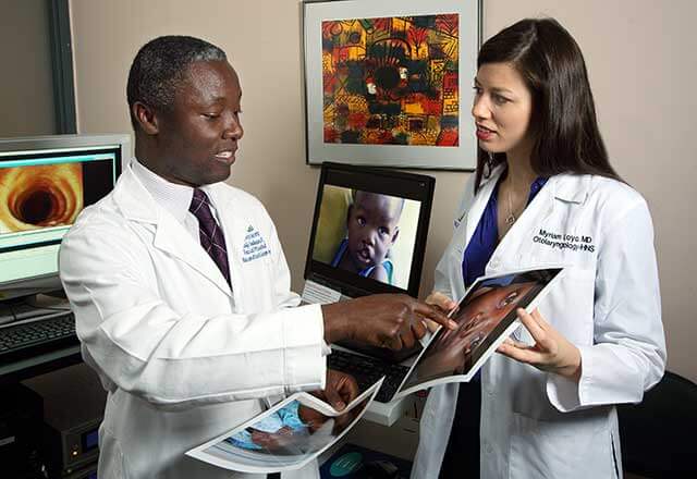 doctors looking at patient