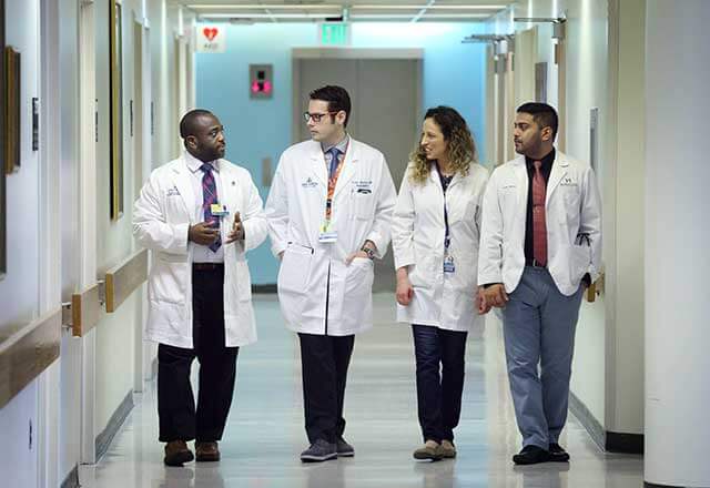 residents walking down hall