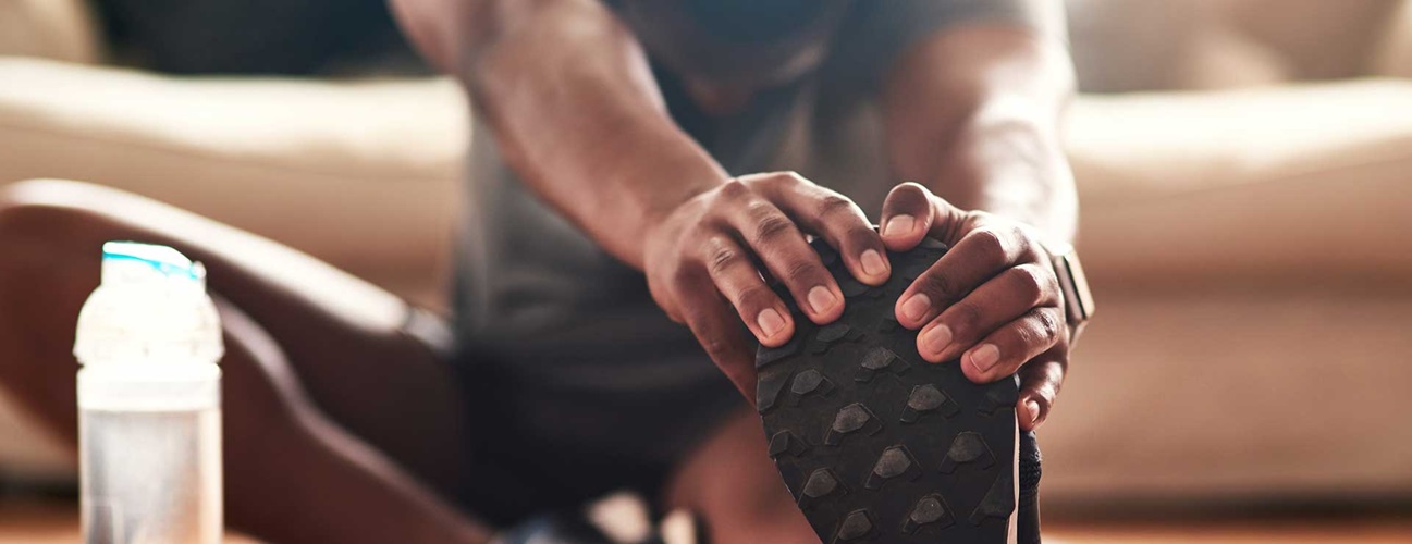 Man stretching before working out.