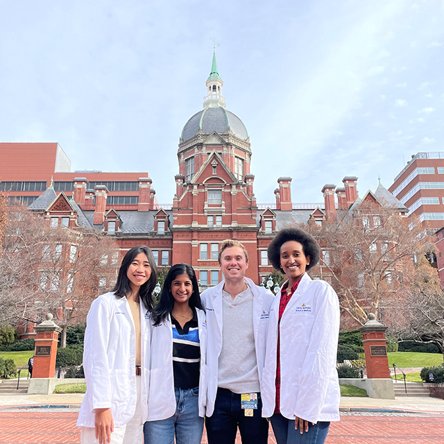 students in front of Billings building