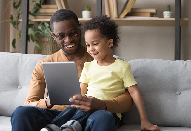 father and son on computer